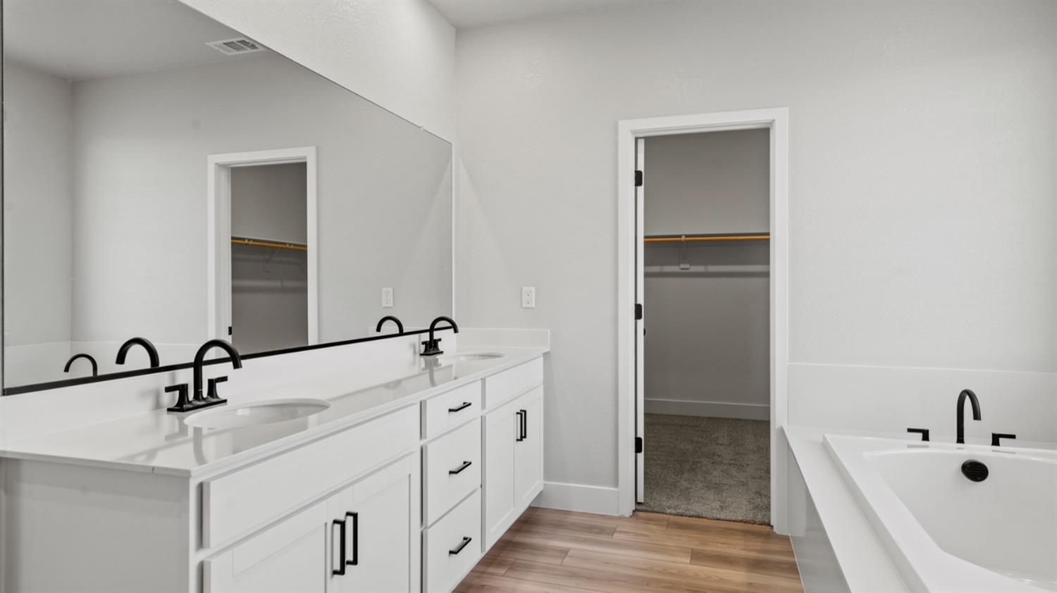 253 Rafters Court Lincoln, CA 95648 - Photo 10 of 14 a bathroom with a double vanity sink mirror and bathtub