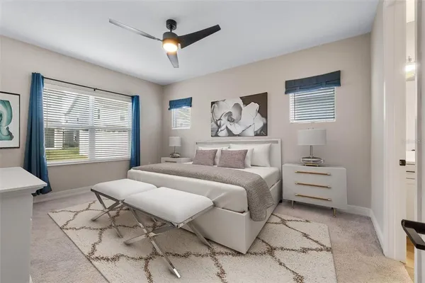 a spacious bedroom with a bed and a window
