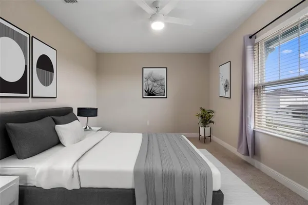 a bedroom with bed and window