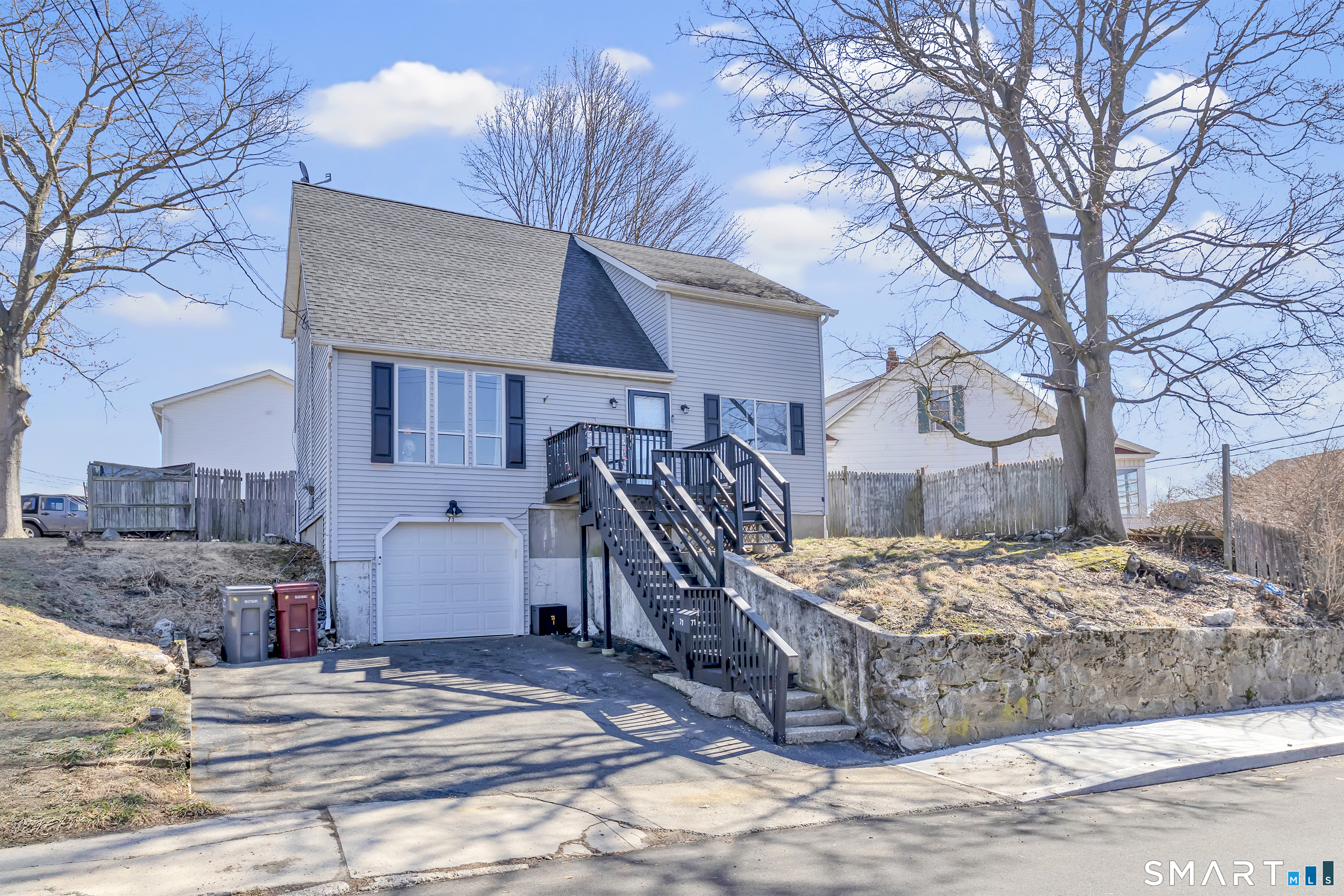 71 Cliff Street Naugatuck, CT 06770 - Photo 1 of 40 a view of a house with snow on the road