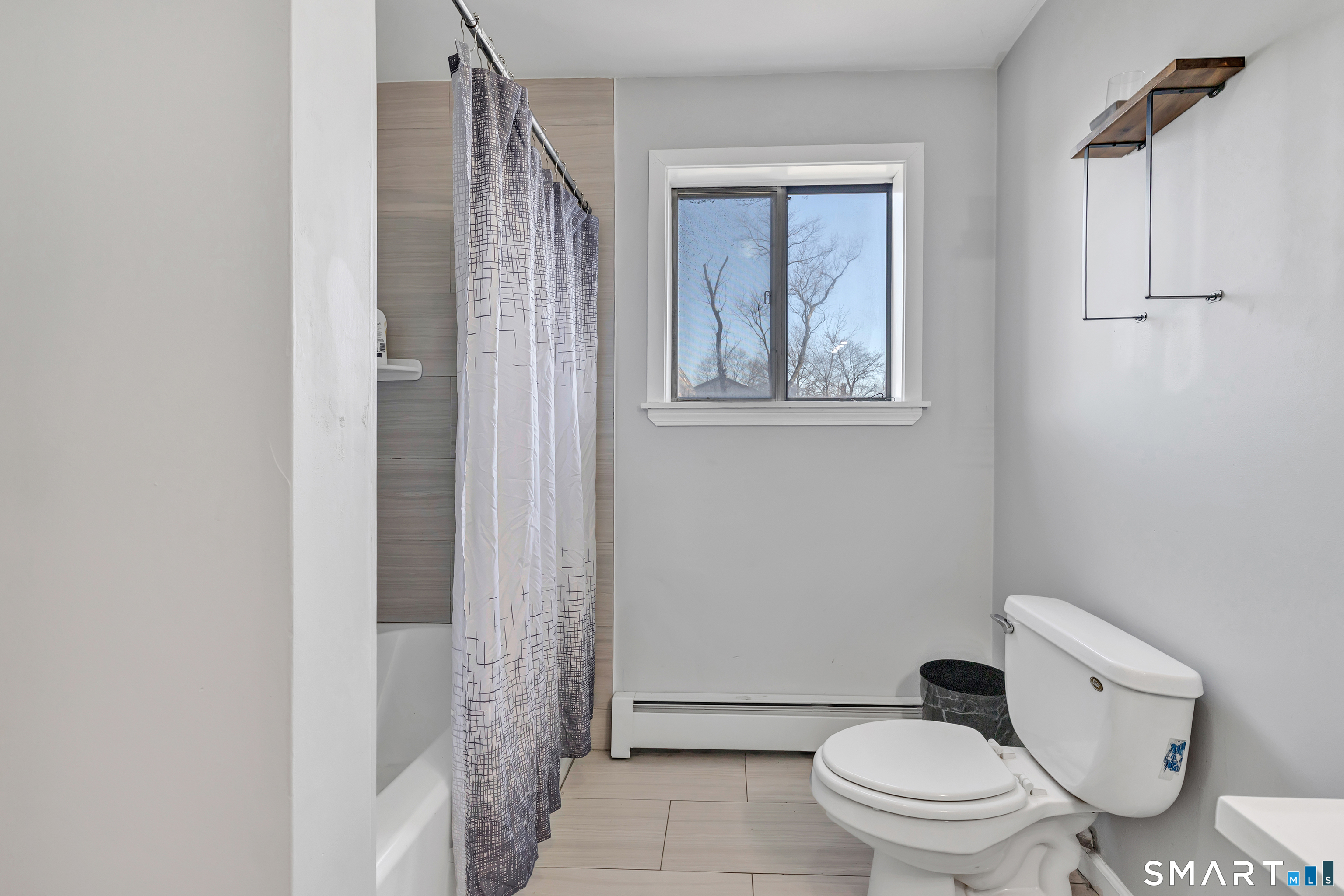71 Cliff Street Naugatuck, CT 06770 - Photo 20 of 40 a white toilet sitting next to a bathroom sink