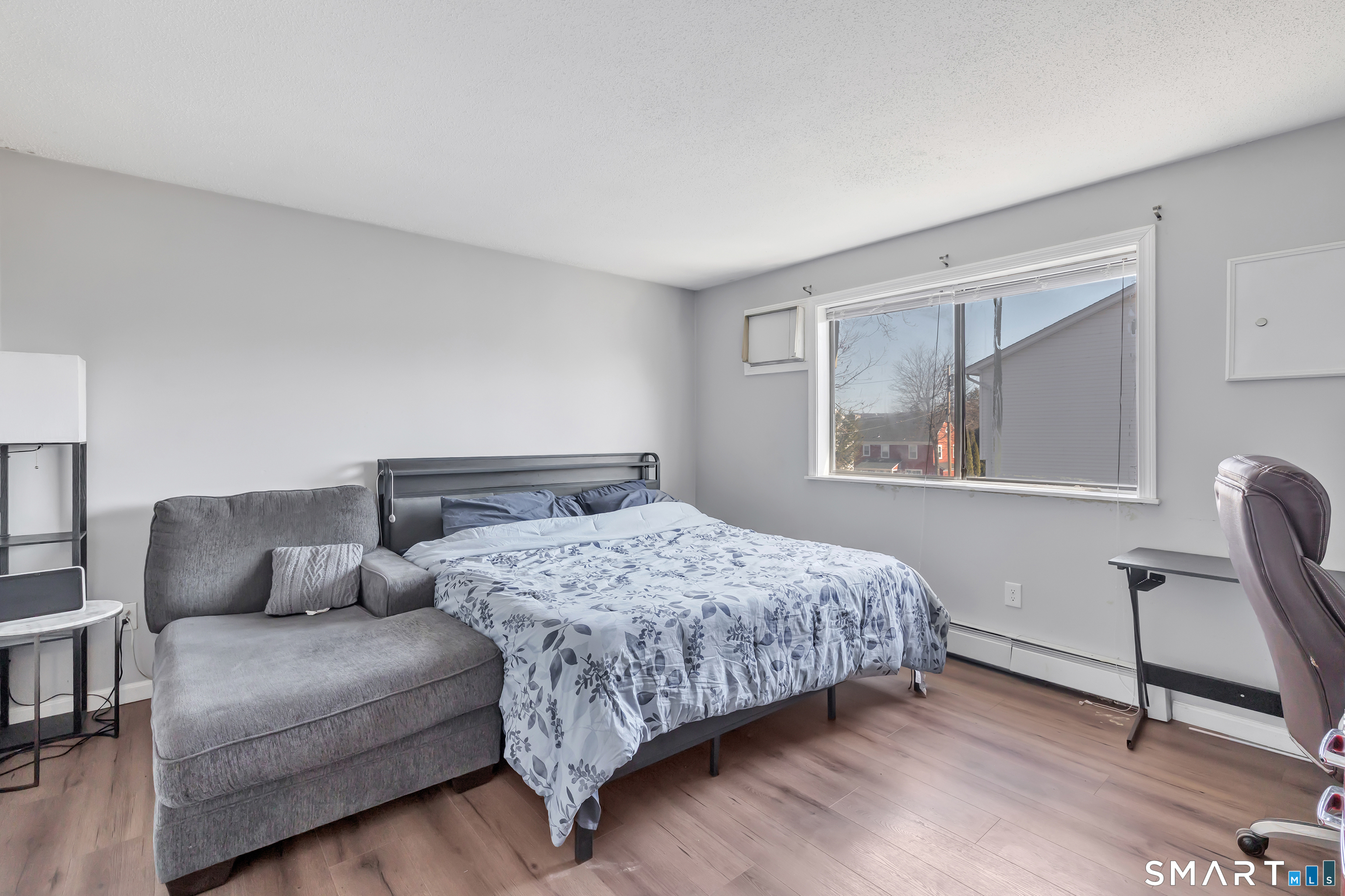71 Cliff Street Naugatuck, CT 06770 - Photo 24 of 40 a bedroom with a large bed couch and a window