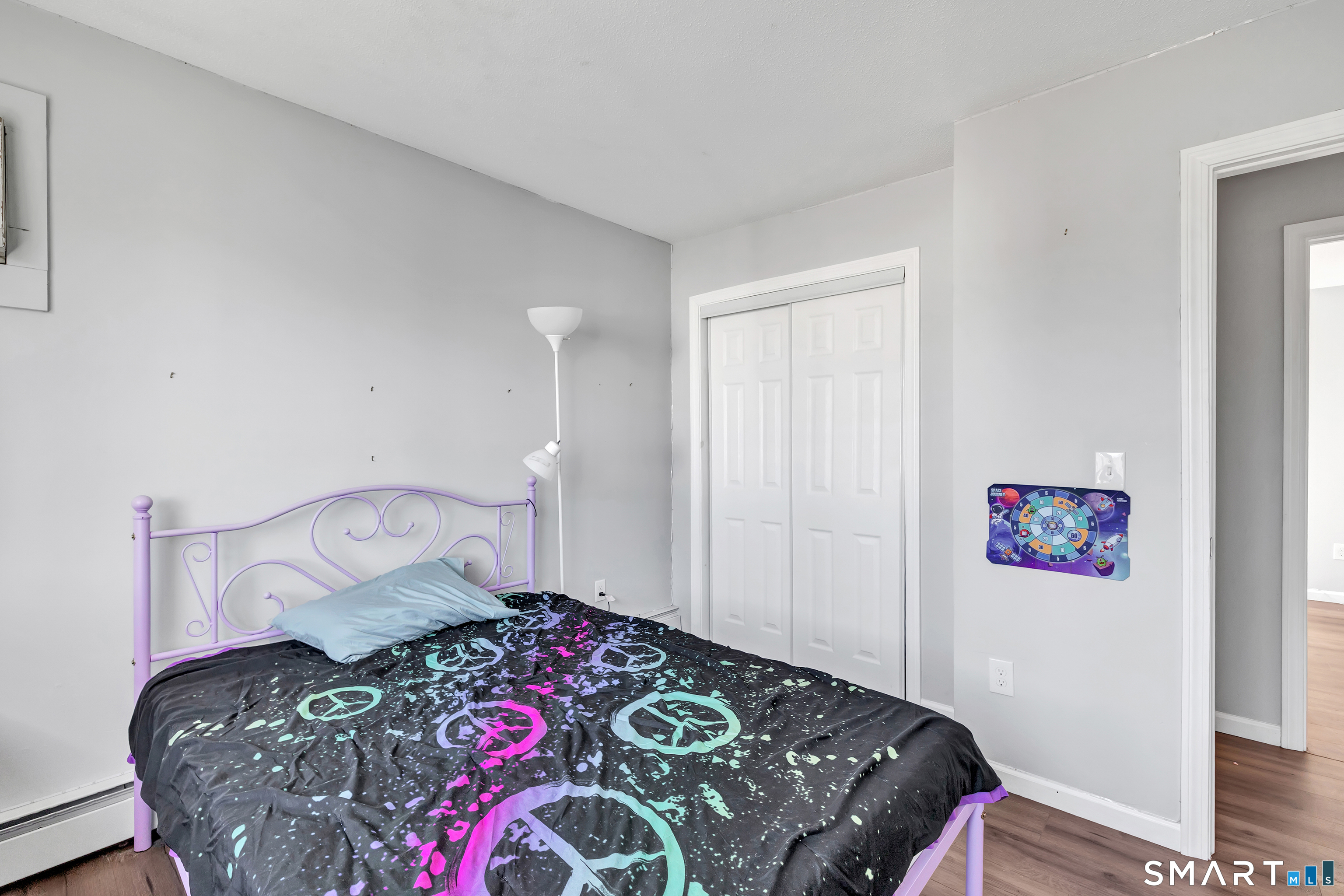 71 Cliff Street Naugatuck, CT 06770 - Photo 26 of 40 a bedroom with a bed and wooden floor