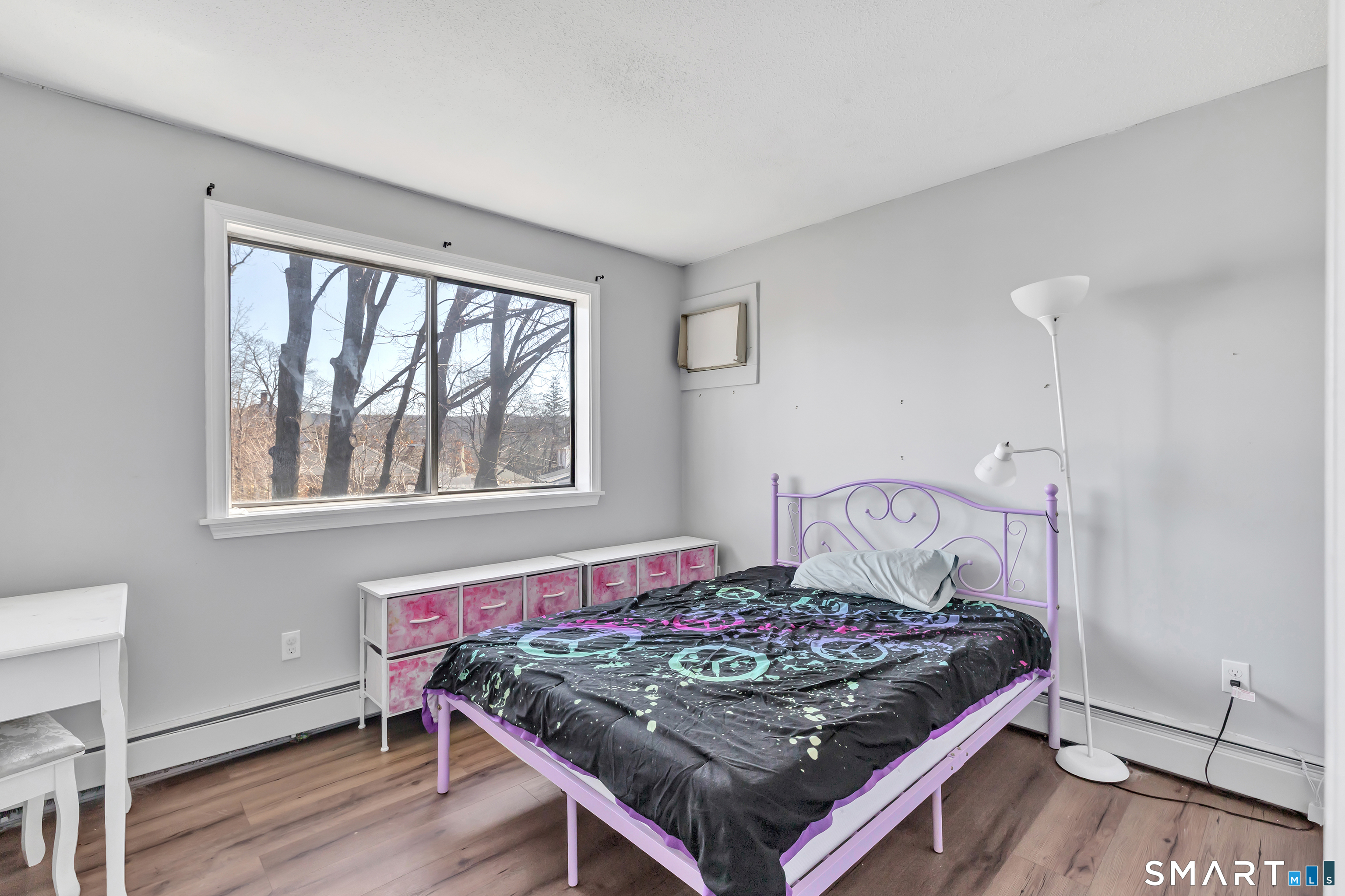 71 Cliff Street Naugatuck, CT 06770 - Photo 27 of 40 a bed sitting in a bedroom next to a window