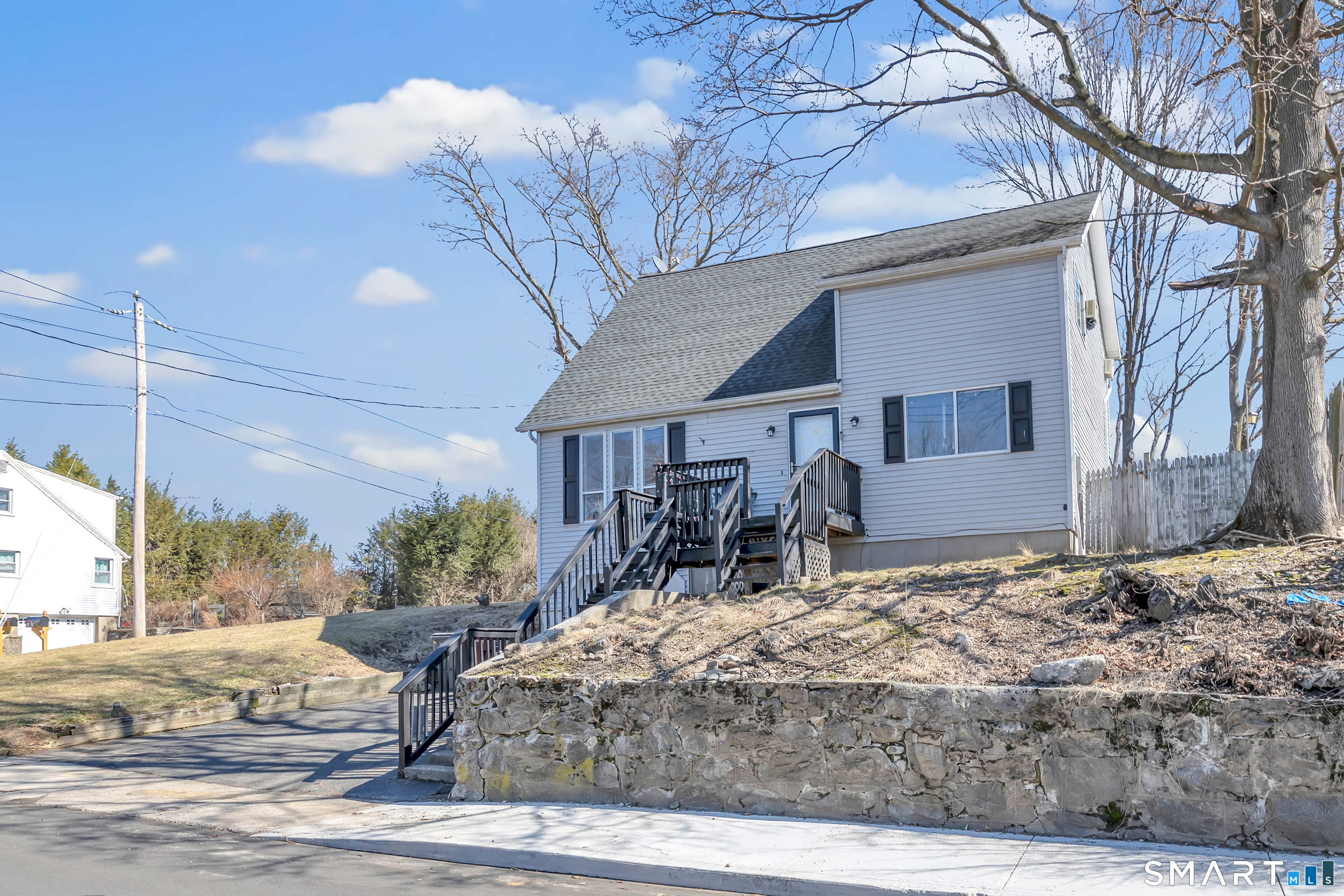 71 Cliff Street Naugatuck, CT 06770 - Photo 3 of 40 a view of a house with a snow on the road