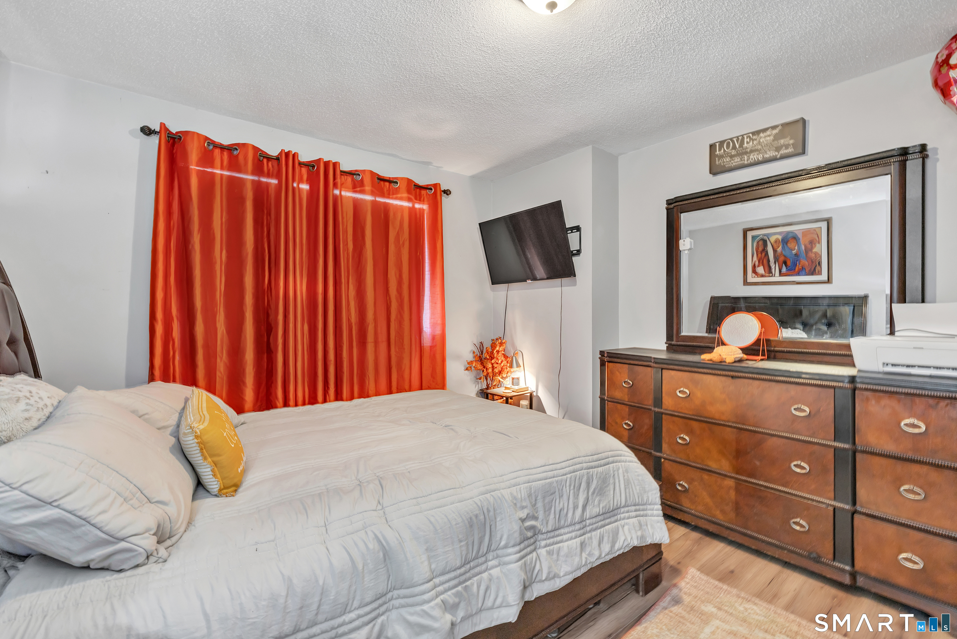 71 Cliff Street Naugatuck, CT 06770 - Photo 32 of 40 a bedroom with a bed and a dresser in it