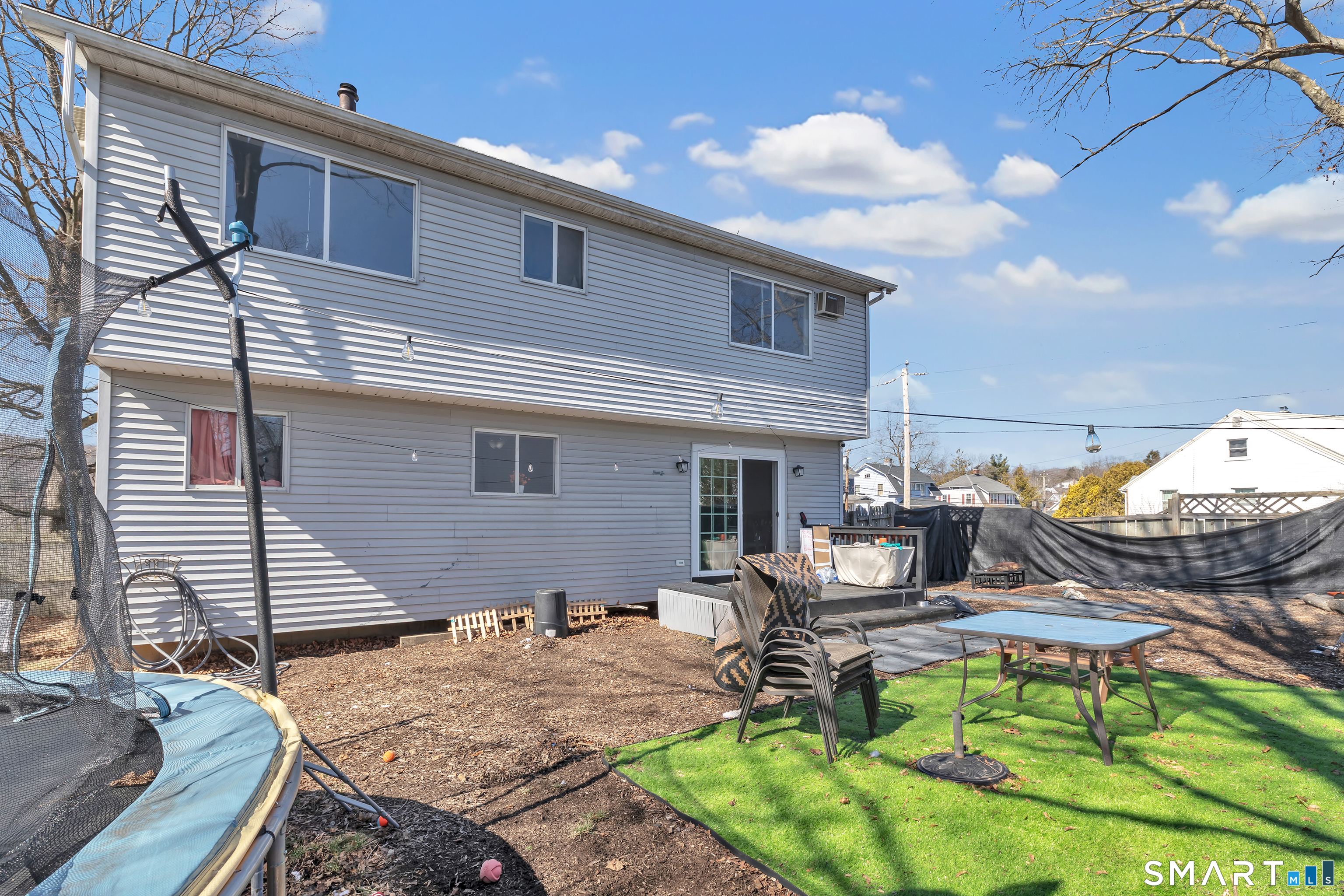 71 Cliff Street Naugatuck, CT 06770 - Photo 37 of 40 a backyard of a house with table and chairs