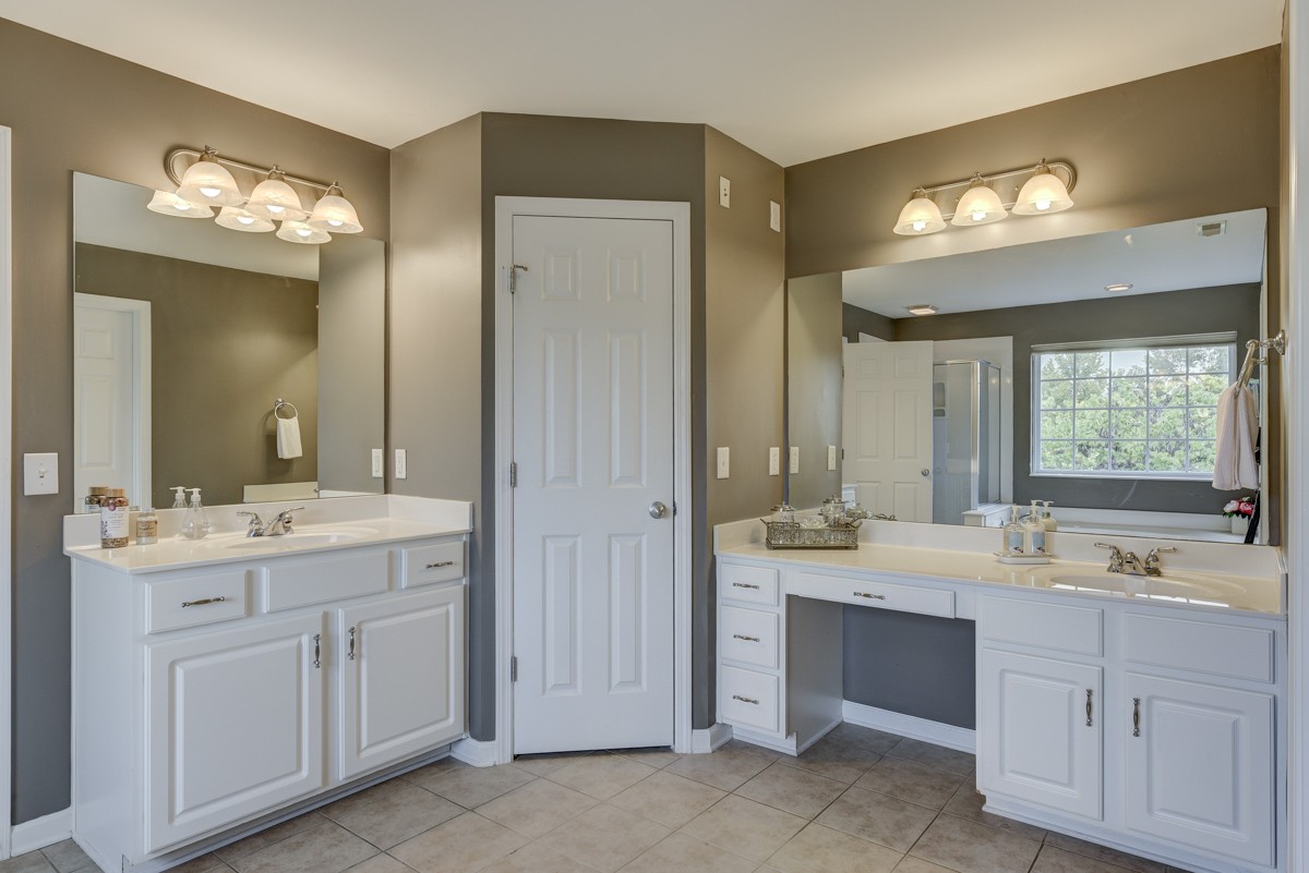 3008 Westerly Drive Franklin, TN 37067 - Photo 14 of 33 a bathroom with a double vanity sink and a mirror