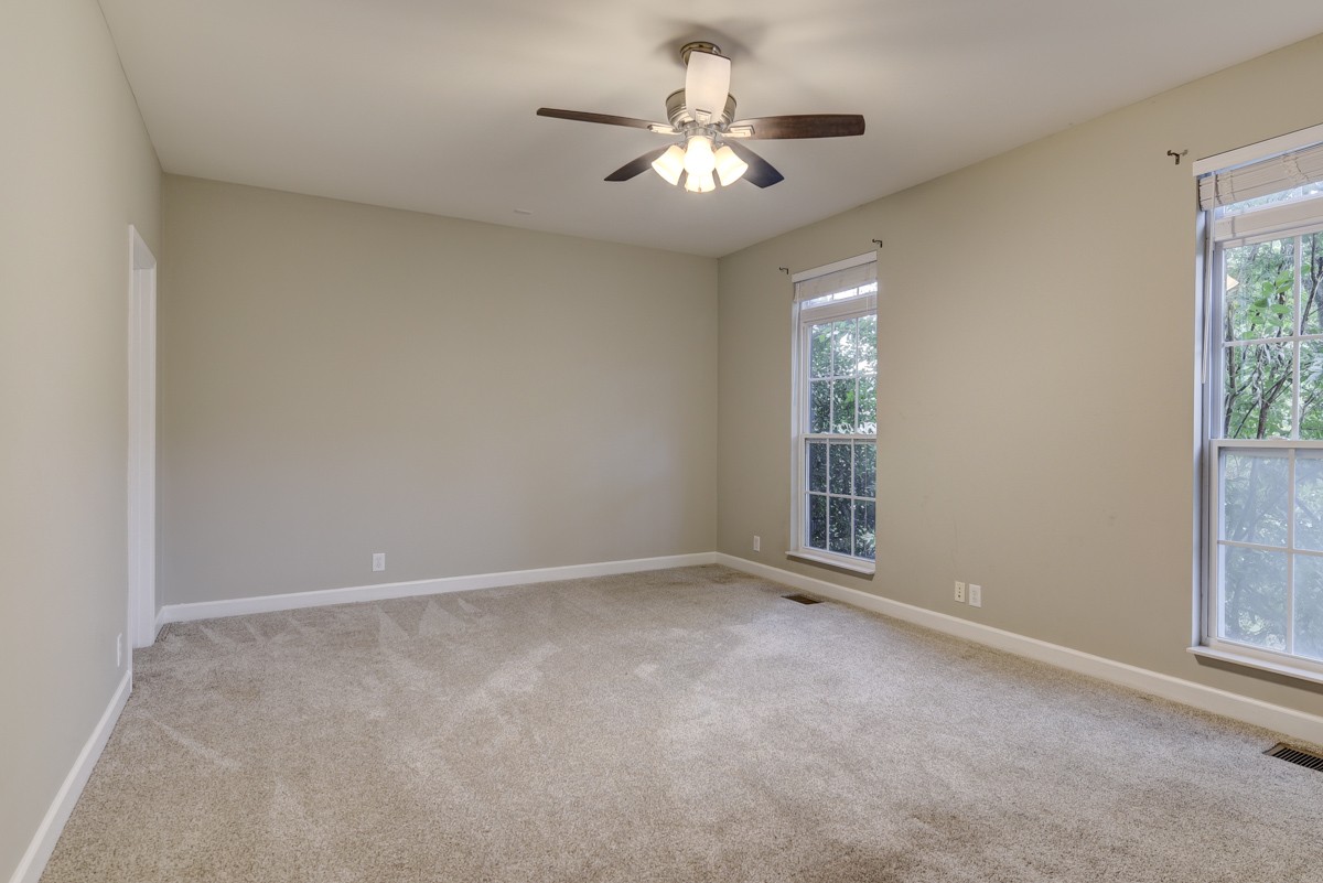 3008 Westerly Drive Franklin, TN 37067 - Photo 16 of 33 an empty room with windows and fan
