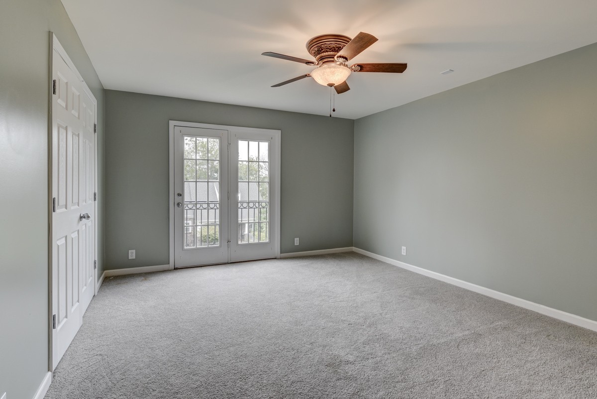 3008 Westerly Drive Franklin, TN 37067 - Photo 20 of 33 an empty room with chandelier fan and windows