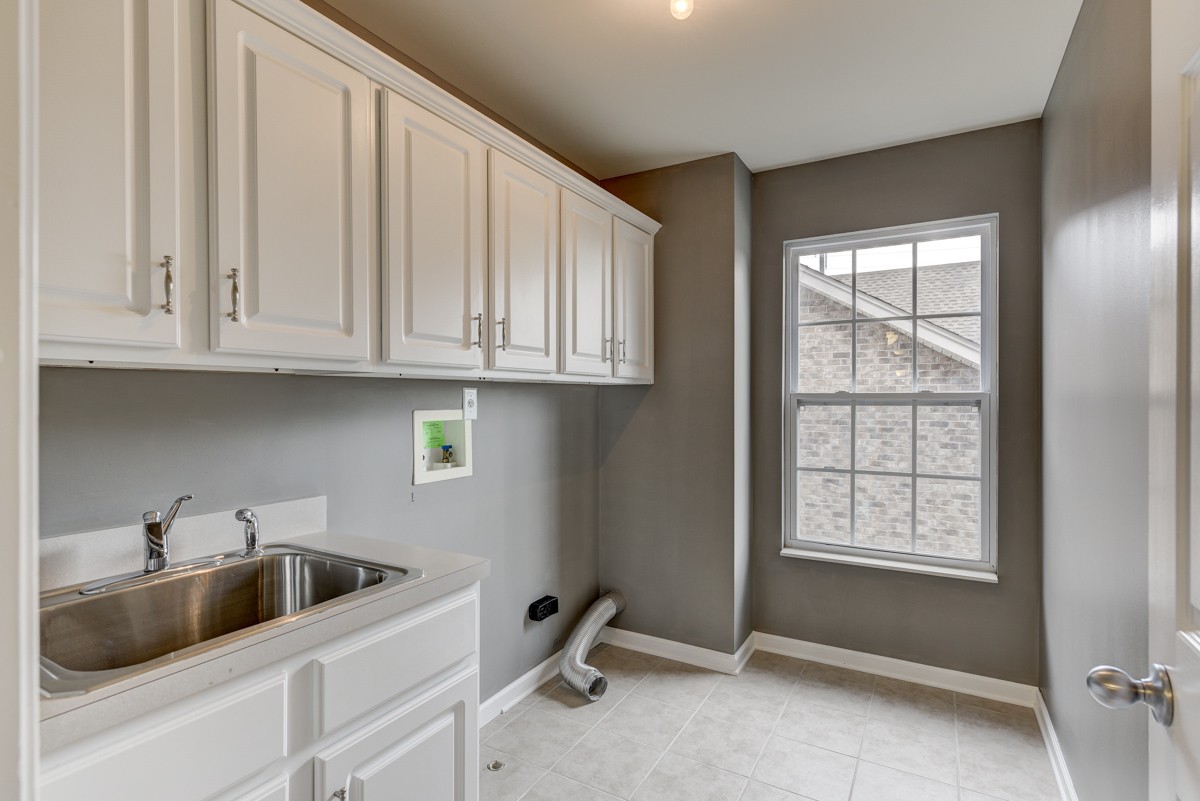 3008 Westerly Drive Franklin, TN 37067 - Photo 23 of 33 a kitchen with stainless steel appliances granite countertop a sink and dishwasher with white cabinets