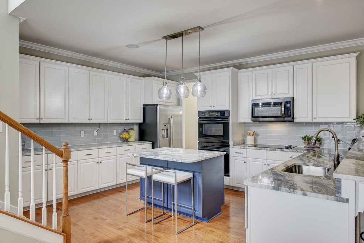 3008 Westerly Drive Franklin, TN 37067 - Photo 9 of 33 a kitchen with granite countertop a sink appliances and cabinets