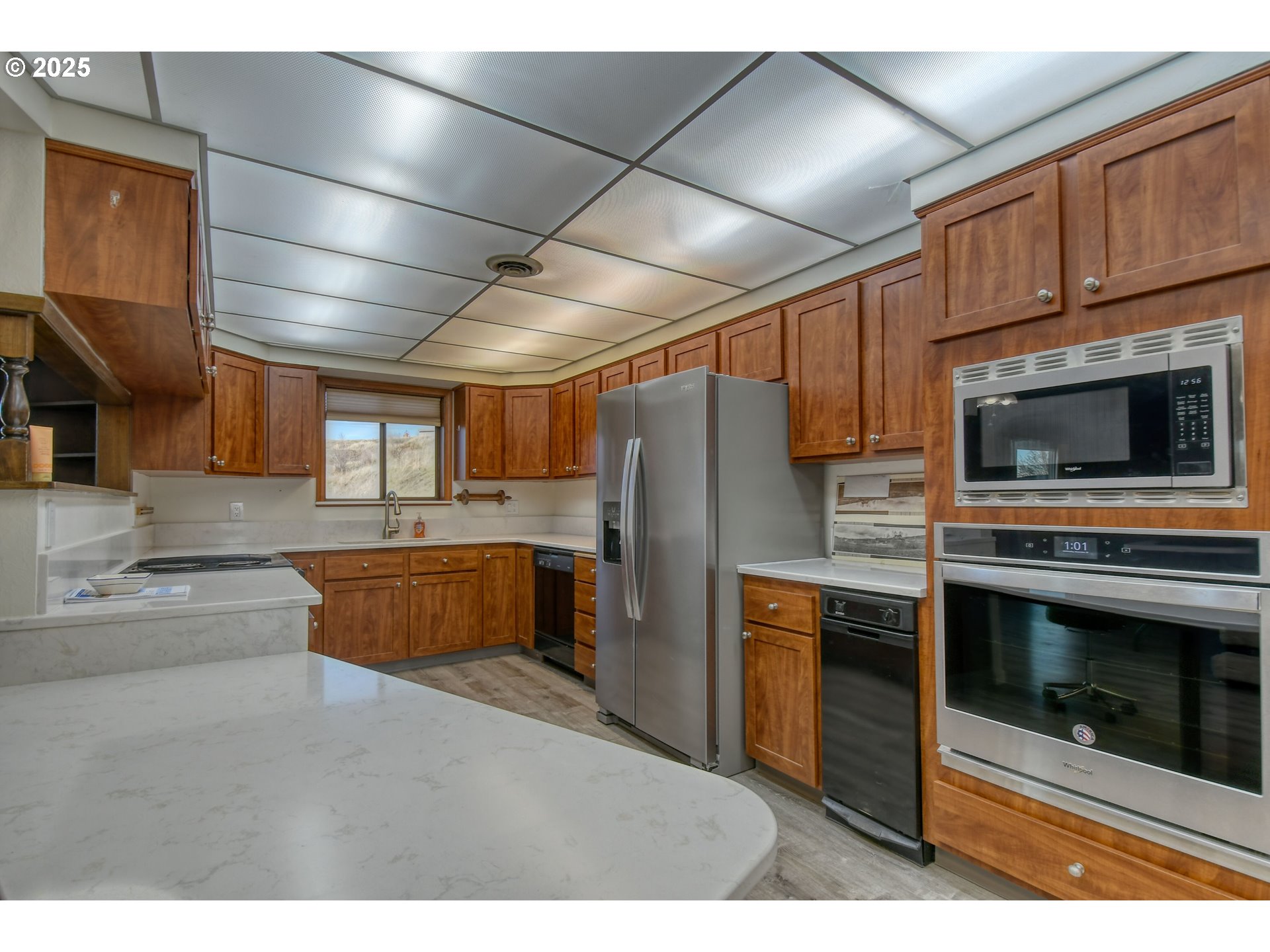 3540 Northeast King Place Pendleton, OR 97801 - Photo 19 of 48 a kitchen with stainless steel appliances kitchen island granite countertop a stove a refrigerator and a sink