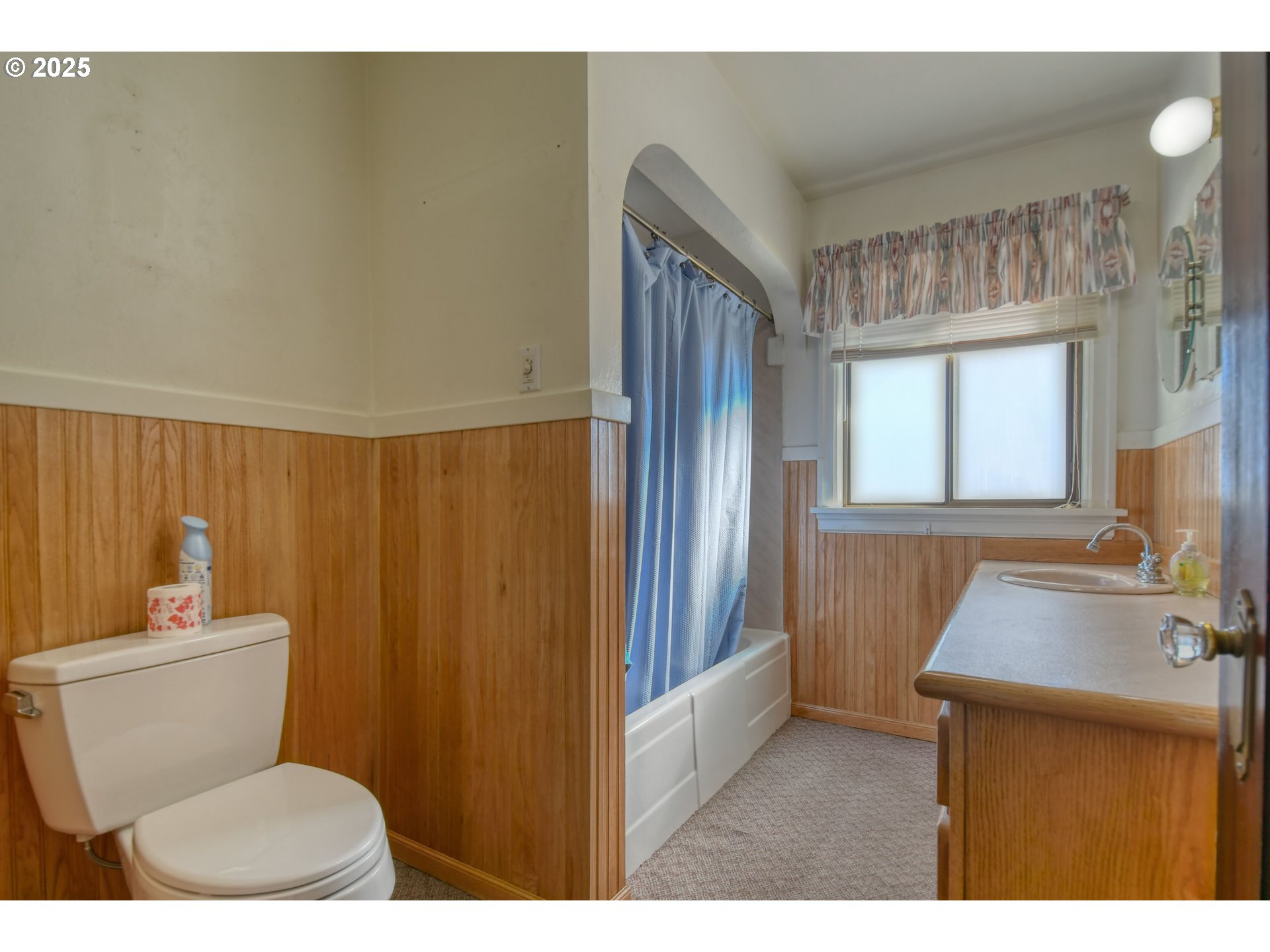 3540 Northeast King Place Pendleton, OR 97801 - Photo 37 of 48 a bathroom with a sink a toilet a mirror and shower curtain