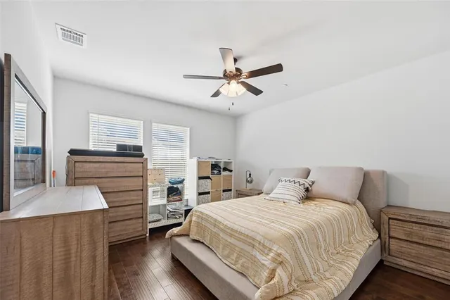 a bedroom with a bed and a cabinets