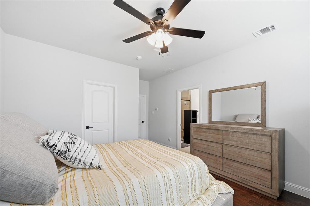 3544 Thistlewood Drive Plano, TX 75074 - Photo 12 of 24 a bedroom with a bed and a dresser