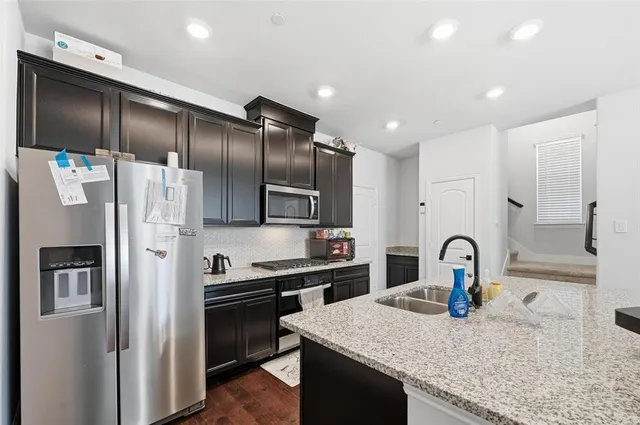 a bathroom with a sink and mirror with toilet