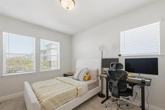 a kitchen with stainless steel appliances granite countertop a stove top oven a sink dishwasher a dining table and chairs with wooden floor