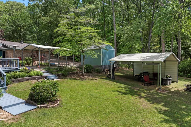 a view of a backyard with patio