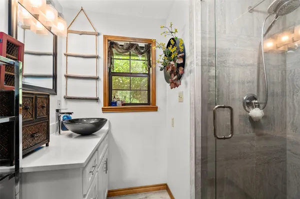 a bathroom with a tub and a shower