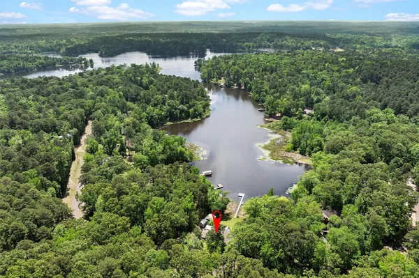 a view of a lake with a yard