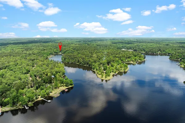 a view of a lake with a yard