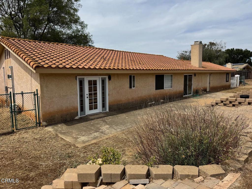 19163 Paradise Mountain Road Valley Center, CA 92082 - Photo 58 of 74 a front view of a house with a yard