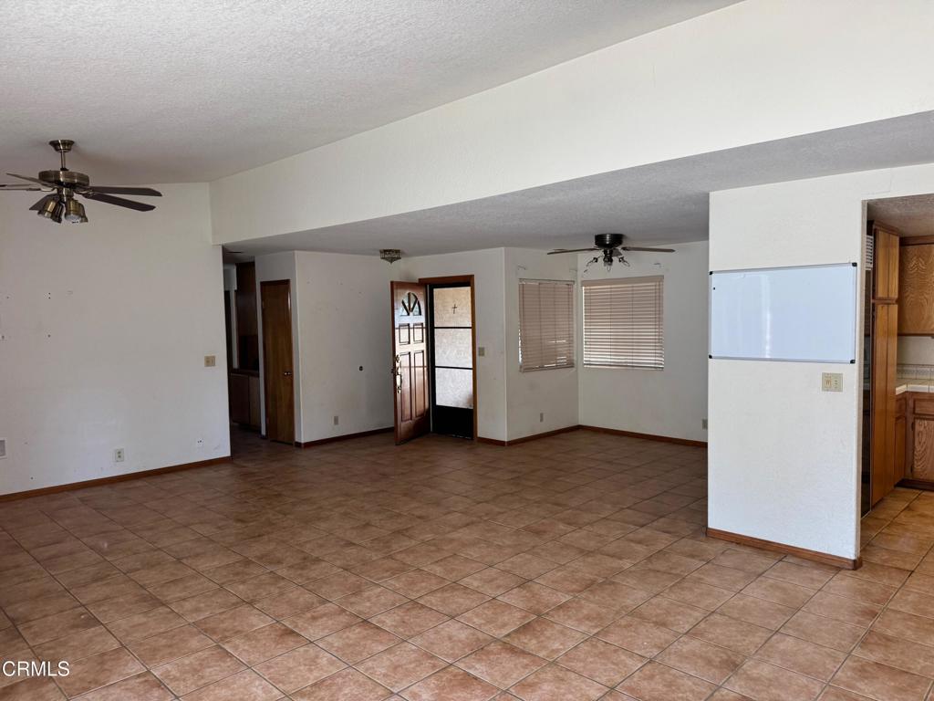 19163 Paradise Mountain Road Valley Center, CA 92082 - Photo 6 of 74 an empty room with closet and windows