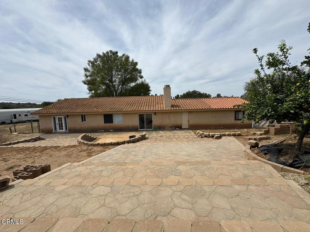 19163 Paradise Mountain Road Valley Center, CA 92082 - Photo 62 of 74 a front view of a house with a yard
