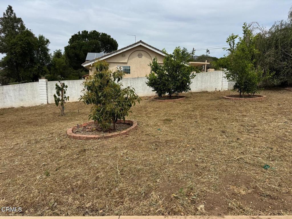 19163 Paradise Mountain Road Valley Center, CA 92082 - Photo 72 of 74 a view of a house with a yard and potted plants