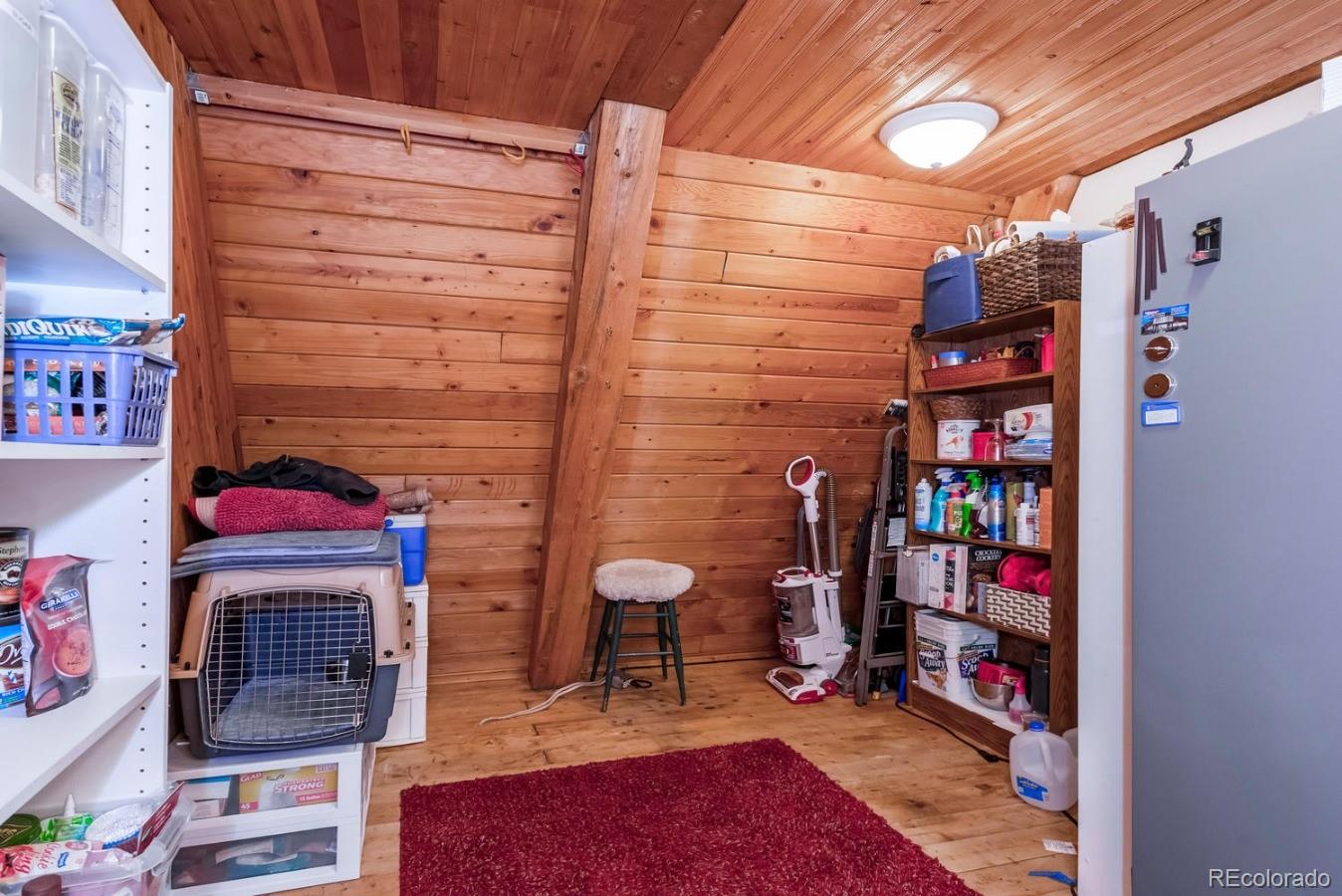 12802 Upper Ridge Road Conifer, CO 80433 - Photo 6 of 27 a view of storage and utility room