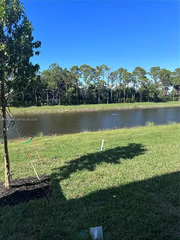 a view of a lake with a yard