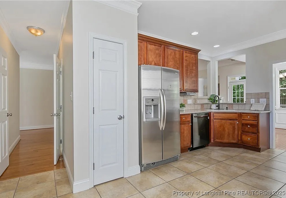 177 Lamplighter Way Spring Lake, NC 28390 - Photo 6 of 21 a kitchen with stainless steel appliances granite countertop a refrigerator and a sink
