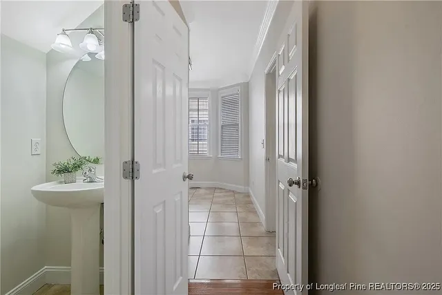 a bathroom with a sink a mirror and shower