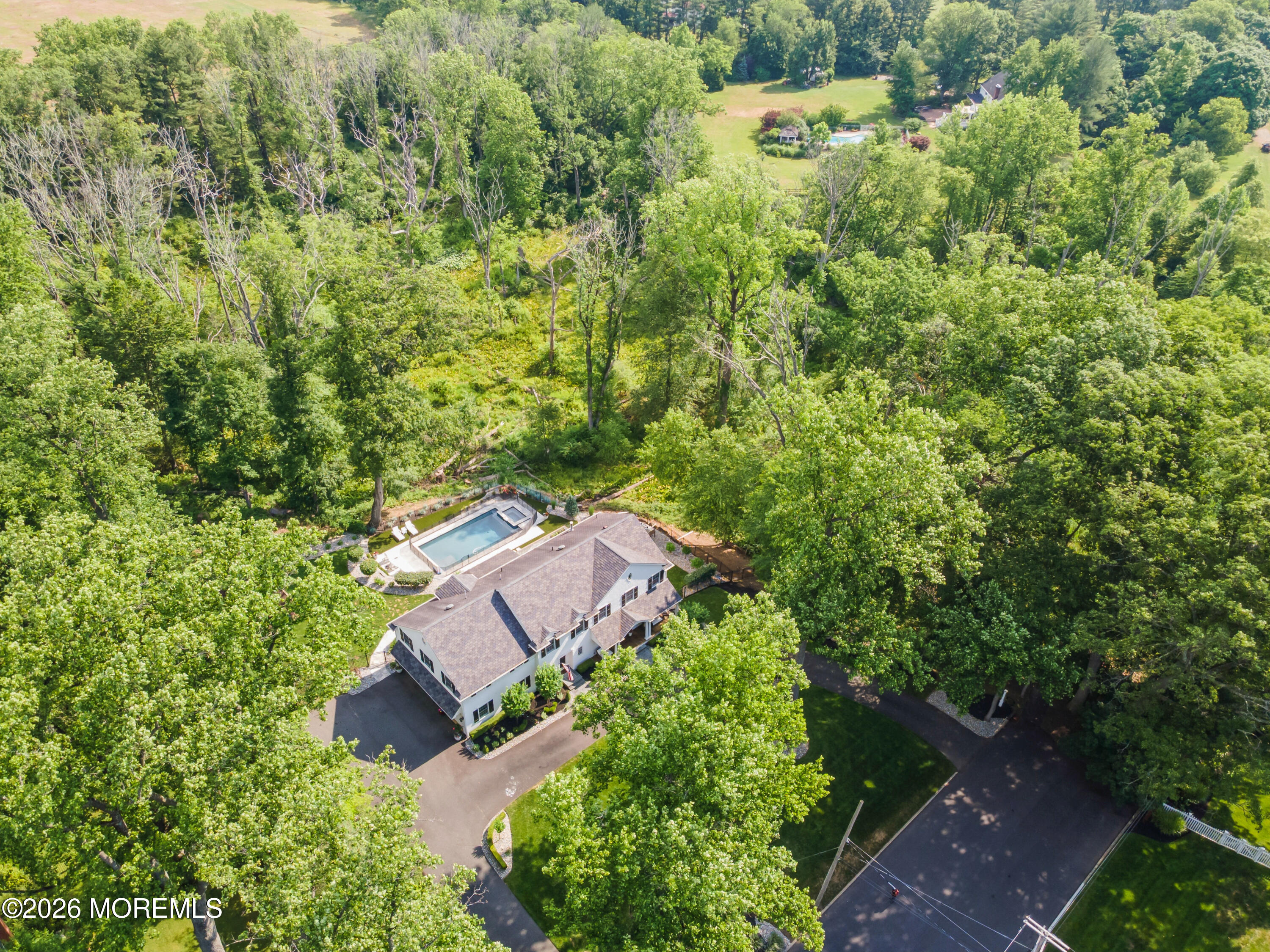 92 Tulip Lane Colts Neck, NJ 07722 - Photo 51 of 55 an aerial view of a house with a yard