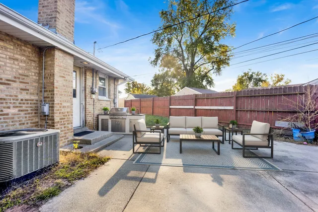 a view of backyard with outdoor seating