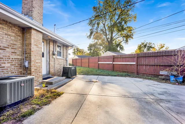a view of a backyard with sitting area
