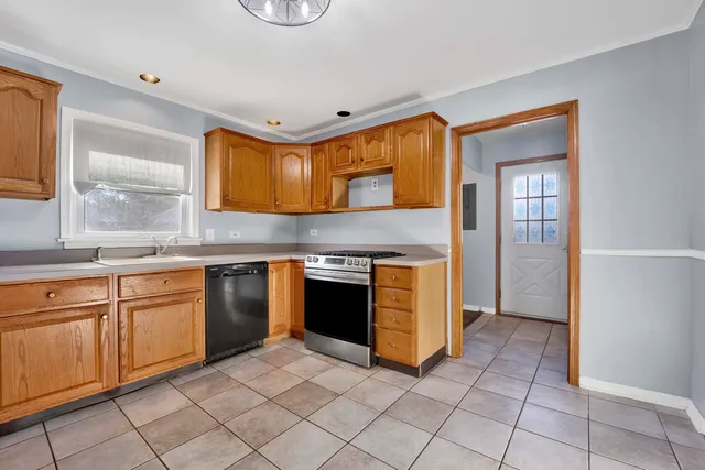 a kitchen with cabinets and oven