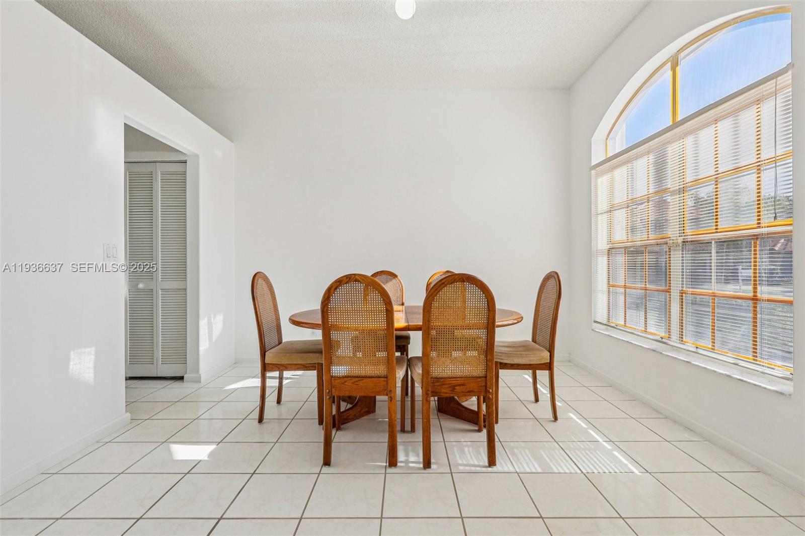 17811 Southwest 4th Court Pembroke Pines, FL 33029 - Photo 12 of 74 a view of a dining room with furniture window and outside view