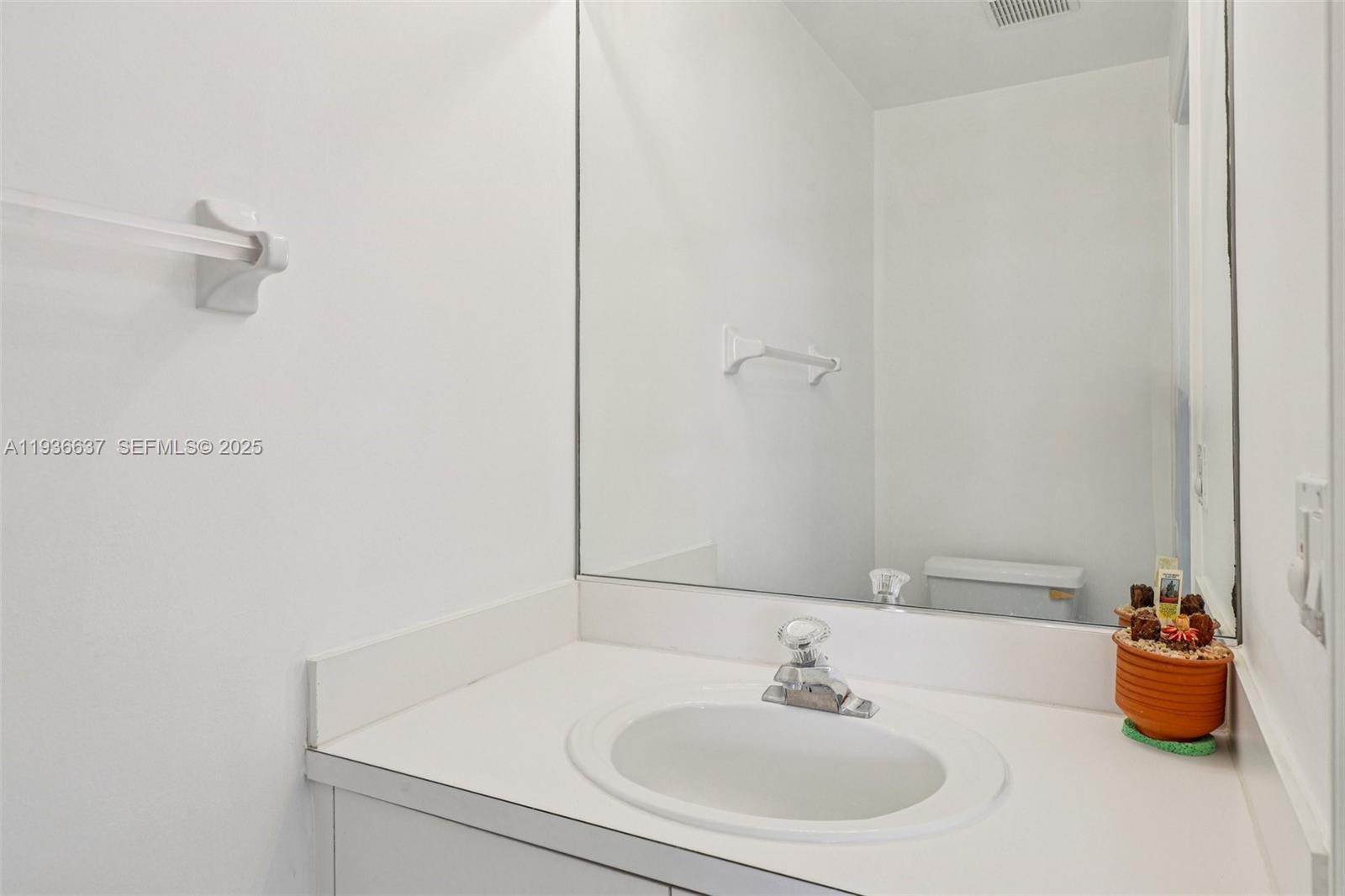 17811 Southwest 4th Court Pembroke Pines, FL 33029 - Photo 16 of 74 a bathroom with a sink and a mirror