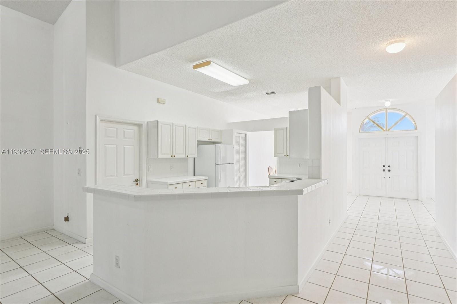 17811 Southwest 4th Court Pembroke Pines, FL 33029 - Photo 18 of 74 a kitchen with stainless steel appliances a sink and cabinets