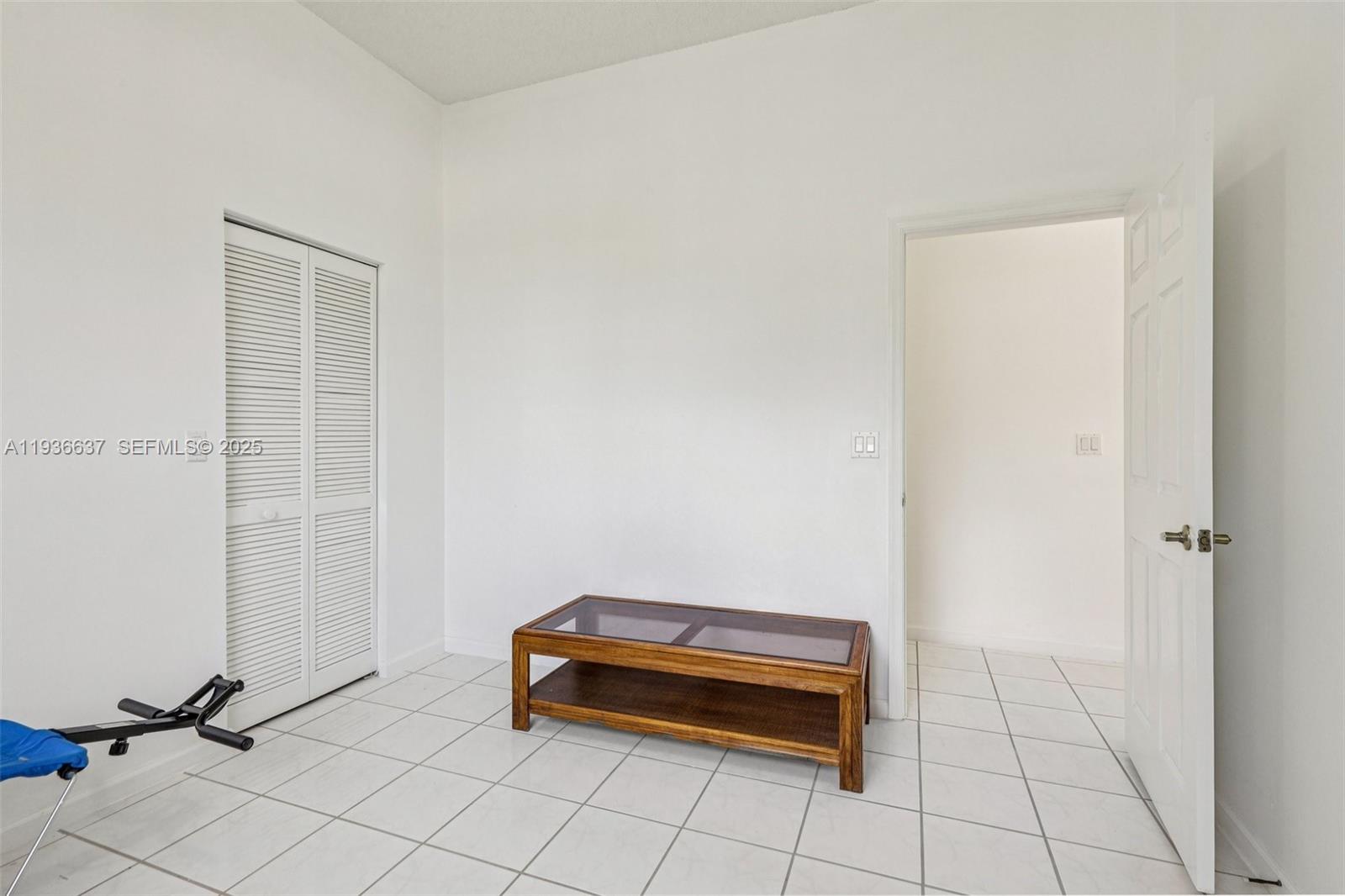 17811 Southwest 4th Court Pembroke Pines, FL 33029 - Photo 45 of 74 a view of a room with a desk and a potted plant