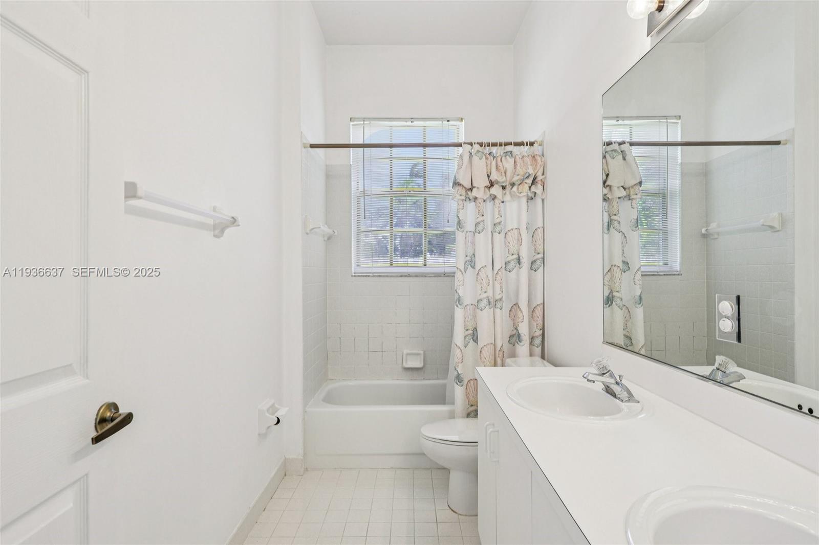 17811 Southwest 4th Court Pembroke Pines, FL 33029 - Photo 47 of 74 a bathroom with a sink a toilet and shower