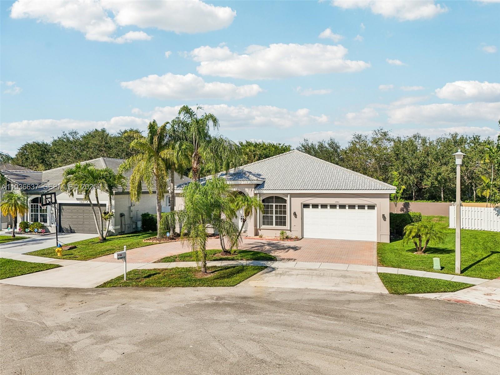 17811 Southwest 4th Court Pembroke Pines, FL 33029 - Photo 57 of 74 a front view of a house with a yard