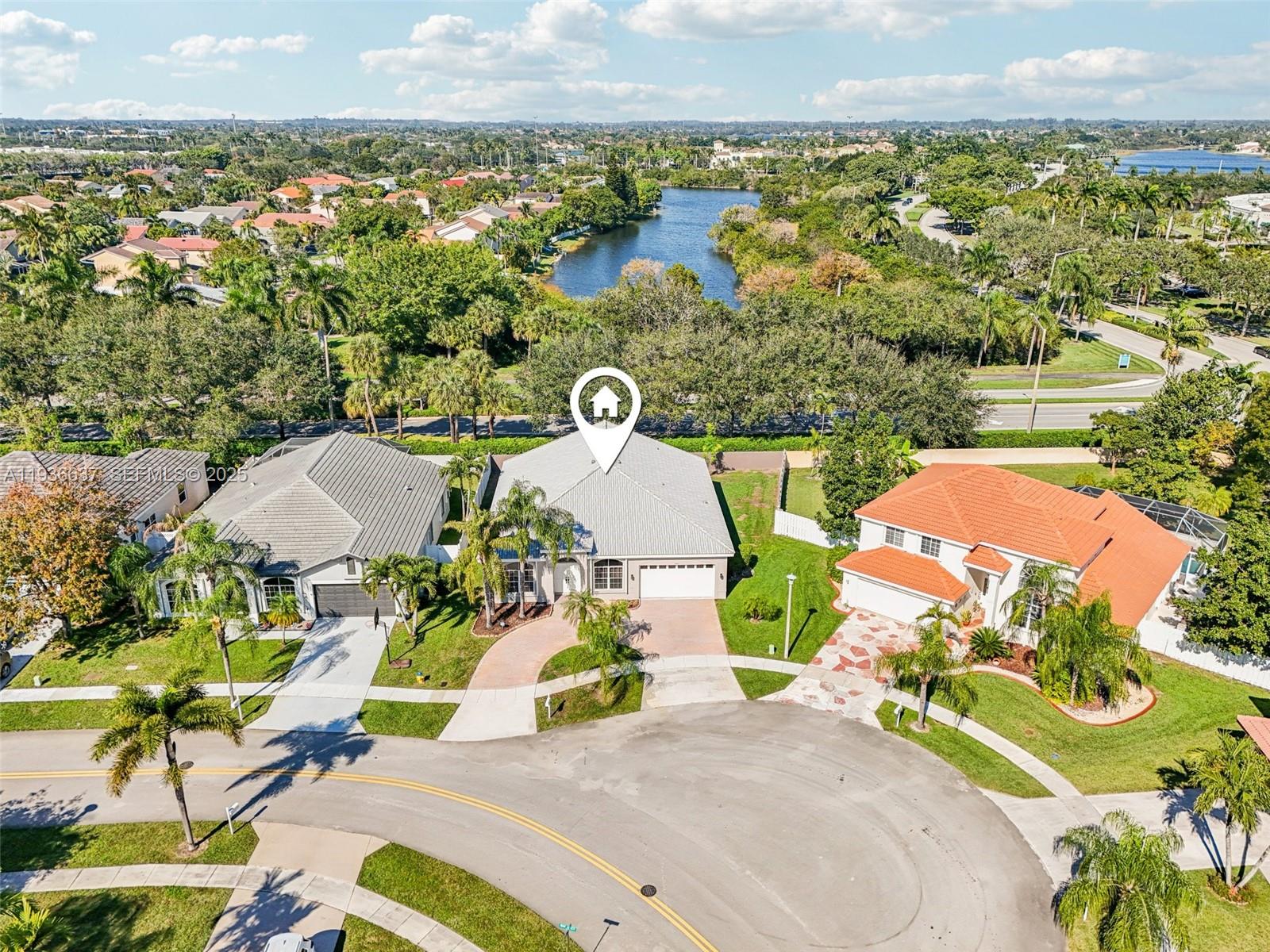 17811 Southwest 4th Court Pembroke Pines, FL 33029 - Photo 60 of 74 an aerial view of a house with a yard and lake view