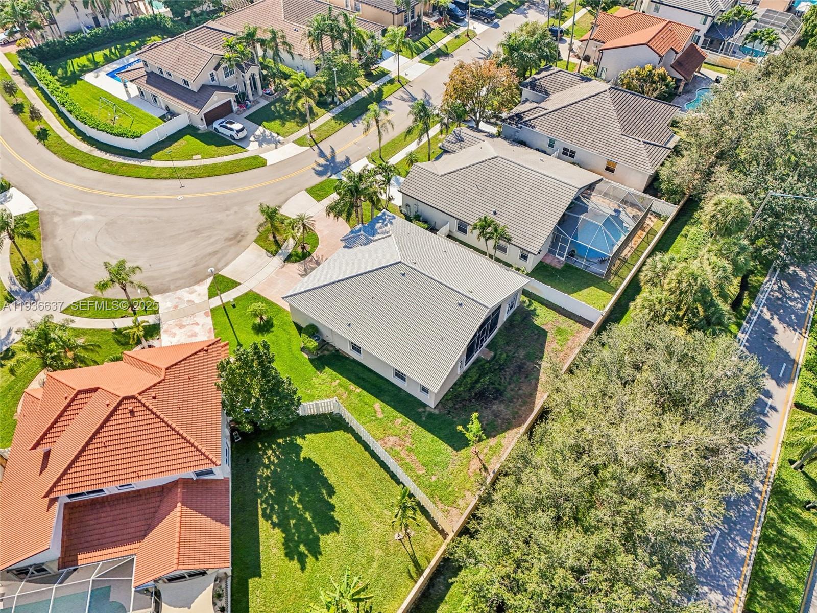 17811 Southwest 4th Court Pembroke Pines, FL 33029 - Photo 64 of 74 an aerial view of a house with a yard and plants