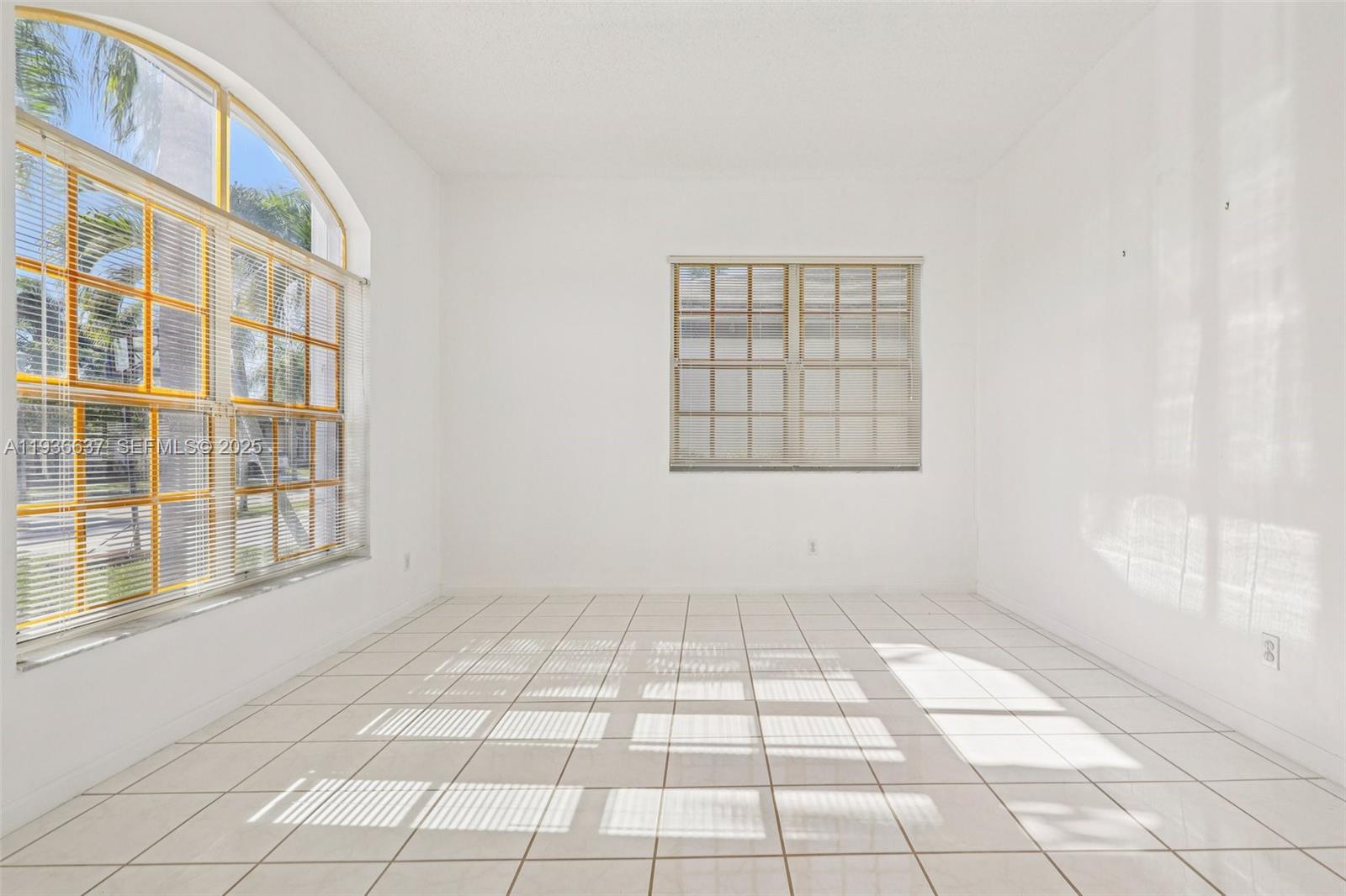 17811 Southwest 4th Court Pembroke Pines, FL 33029 - Photo 8 of 74 a view of an empty room with windows