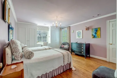 a bedroom with bed and window