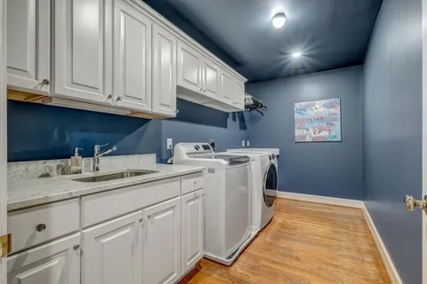 a utility room with cabinets