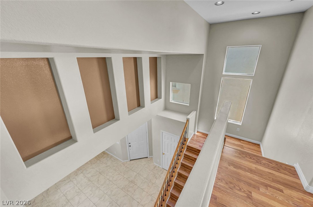 977 Sparkling Light Street Henderson, NV 89052 - Photo 40 of 75 This spacious foyer features soaring ceilings and a graceful staircase.